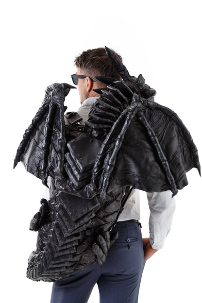 Leather dragon-backpack hugging you,  LUMINESCENT PATTERN, dragon tail wraps your waist, puts paws on shoulders, covers your shoulders wings