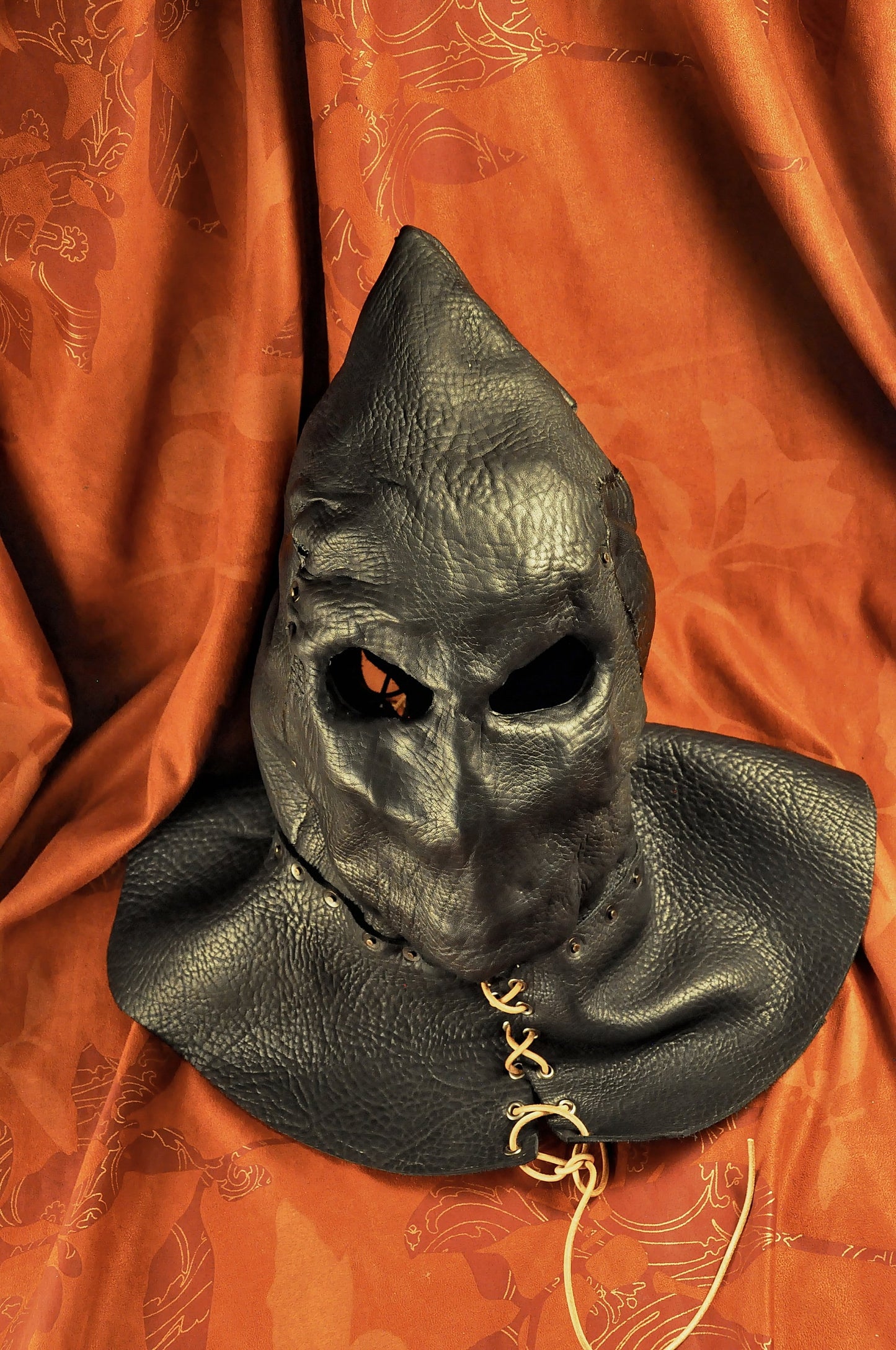 Executioner hood black leather, slits for breathing opposite the mouth, ventilation slits at temples (according to the customer's decision)