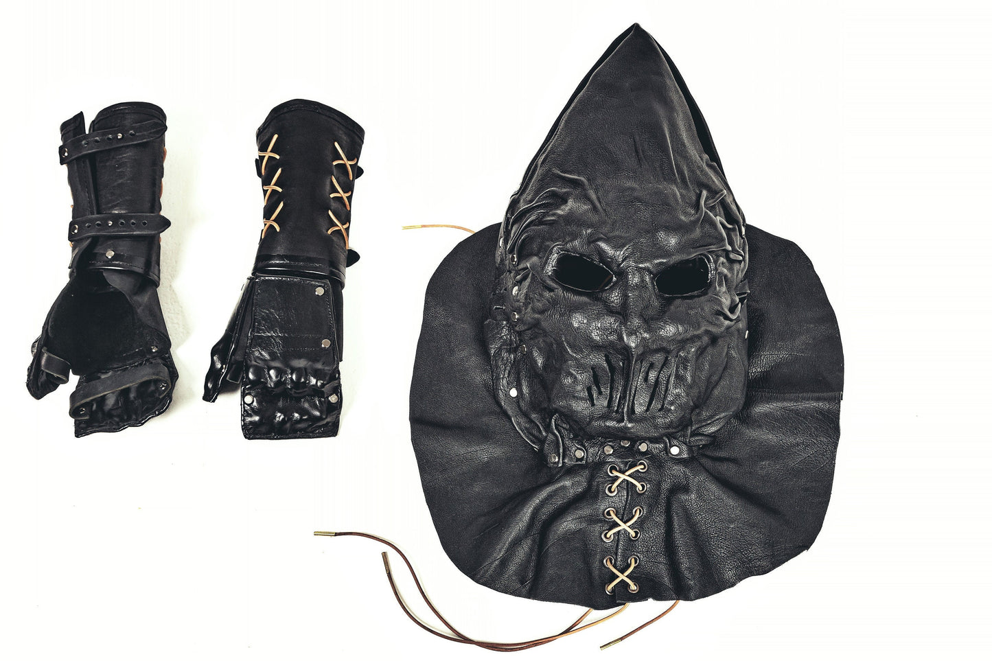 Black Leather Executioner Hood with special cutouts opposite the mouth and ears and Black Leather Gauntlets: A Dark and Enigmatic Set