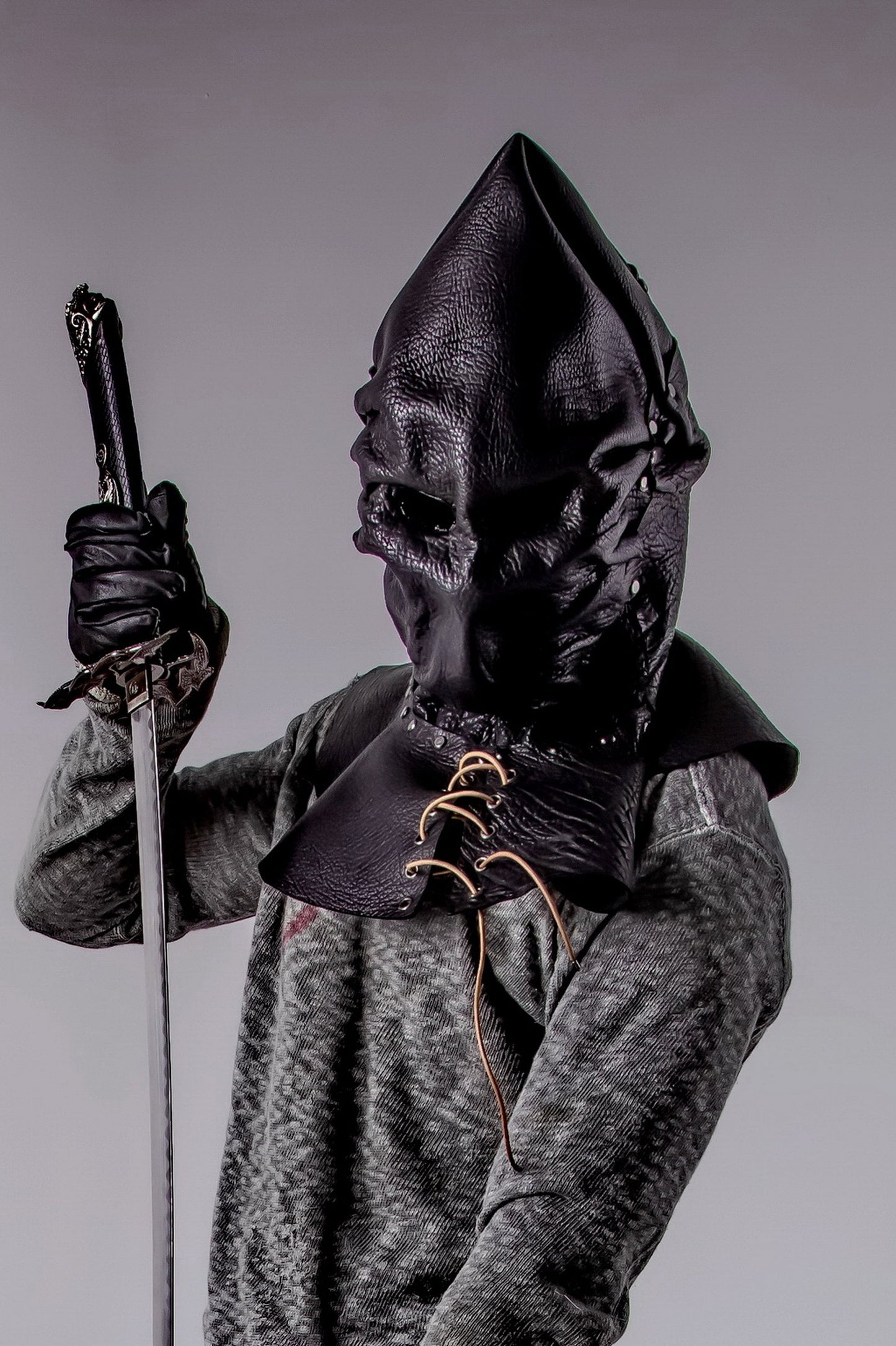 Executioner Hood in black leather, made from natural leather and recycled plastics (core).