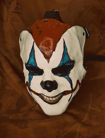 White Leather Mask "Trickster Clown" , with coloring, with five strap-system, red mouth, blue diamonds eyes outline, black normal nose.